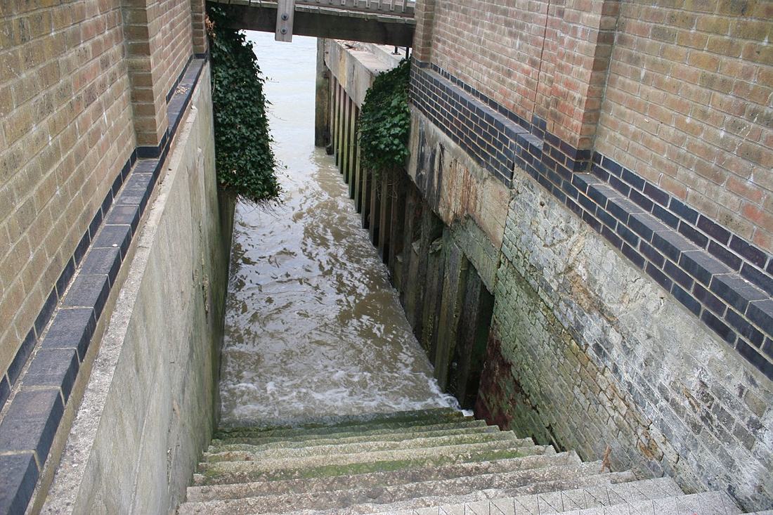 Stone stairs beside the River Thames.